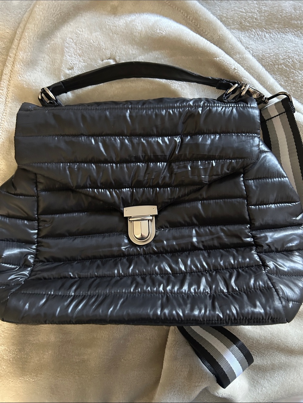 THINK ROYLN Black Quilted Puffer Shoulder Bag with Striped Strap